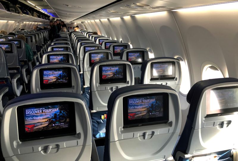 FILE PHOTO: Video screens are shown built into the backs of passenger seats onboard a Delta Airlines Boeing 737-900ER aircraft in San Diego