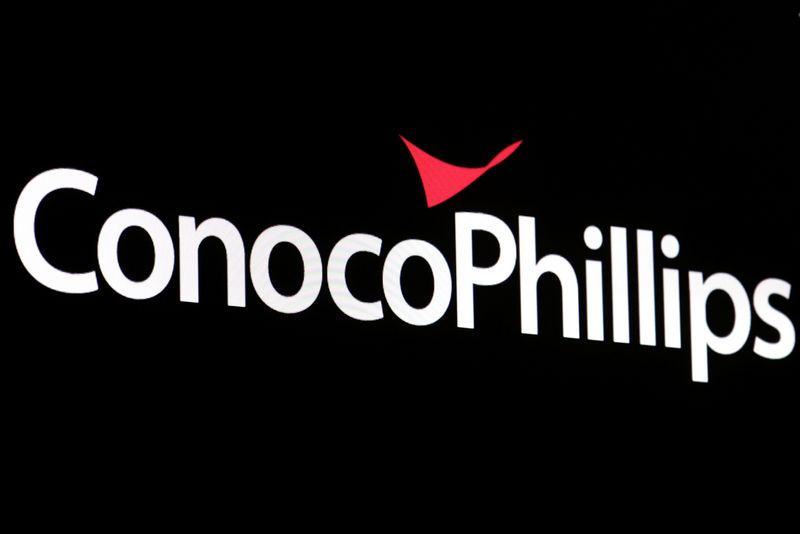 A screen displays the logo for ConocoPhillips on the floor of the NYSE in New York