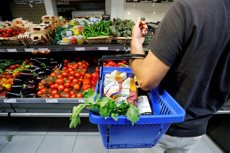 FILE PHOTO: A customer shops in a supermarket in Nice