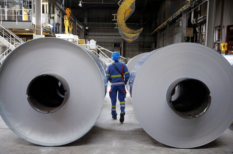 FILE PHOTO: An operator prepares to lift a coil of aluminium with a hoist at the Neuf-Brisach Constellium aluminium products company's production unit in Biesheim