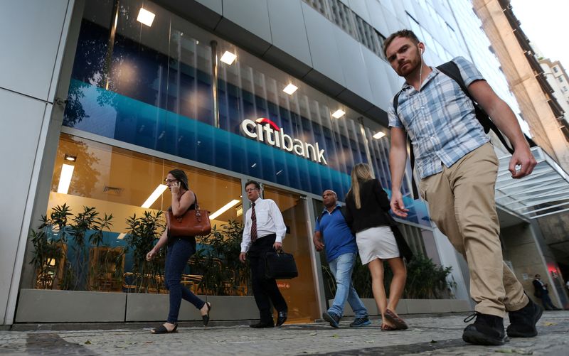 FILE PHOTO: People walk past a Citibank branch in Rio de Janeiro