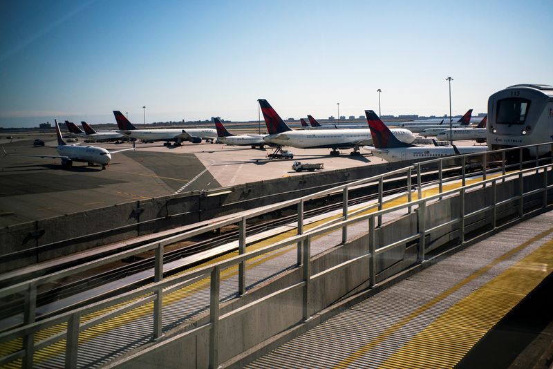 FILE PHOTO: Planes are seen at the tarmac after the Federal Aviation Administration (FAA) temporarily halted flights arriving at New York City airports due to coronavirus disease (COVID-19) in New York