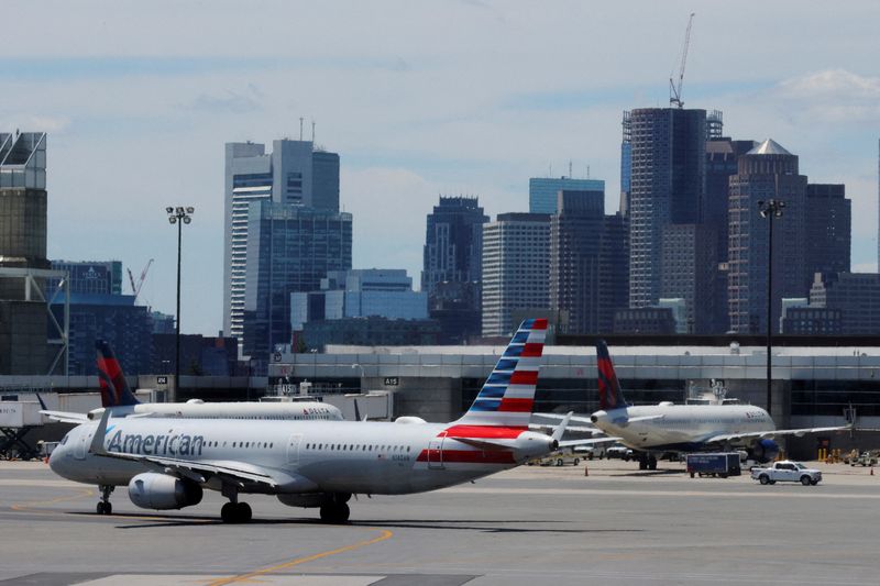 FILE PHOTO: Travelers at Logan Airport ahead of the July 4th holiday weekend in Boston