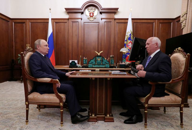 FILE PHOTO: Russian President Vladimir Putin meets with Rostec CEO Sergey Chemezov in Moscow