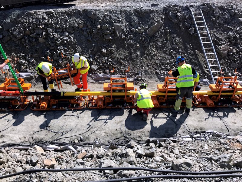 FILE PHOTO: Workers lay a NordLink subsea interconnector power cable to connect Norway and Germany at the Vollesfjord fjord near Flekkefjord