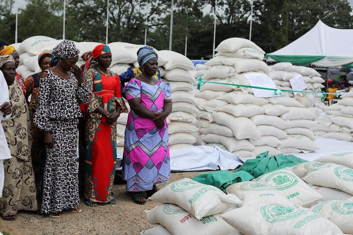 Indigent groups in the Federal Capital Territory attend the distribution of food items by the government to cushion the high cost of living in Abuja