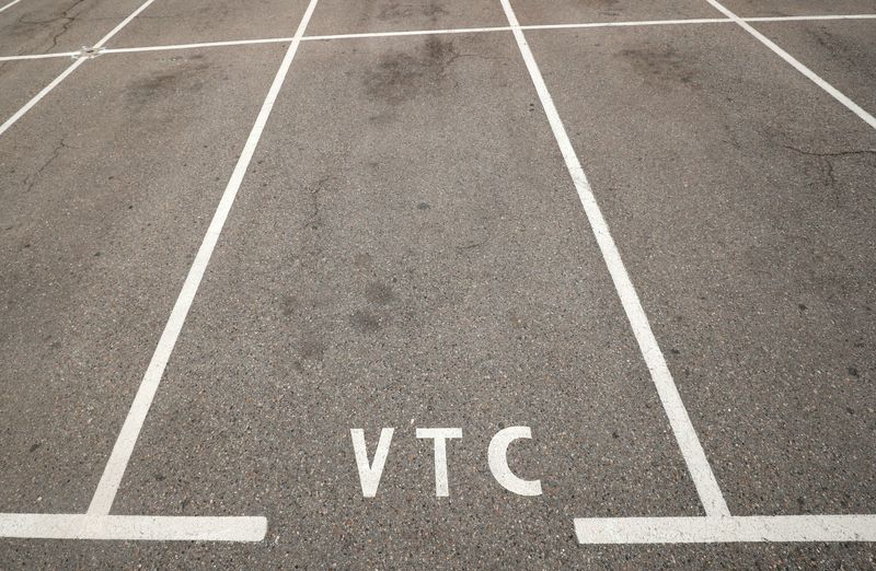 FILE PHOTO: Empty parking spots for ride-hailing services, know in Spain as VTC (transport vehicles with driver) are seen at Barcelona's airport