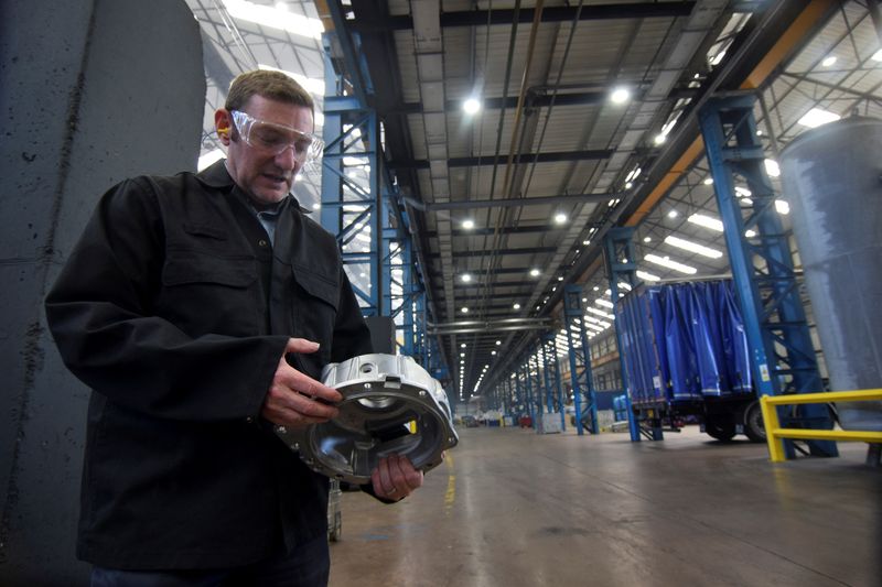 ARCHIV: Brett Parker, business director of Evtec Aluminium Ltd, holds an aluminium engine part, in Kidderminster