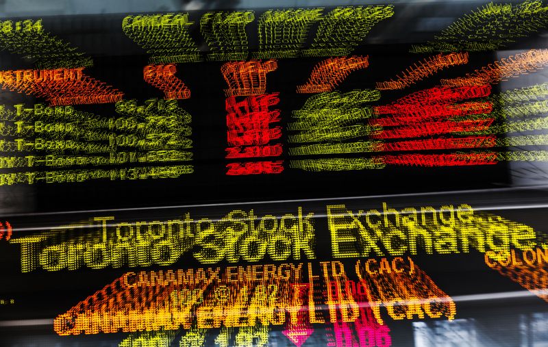 A sign board displaying Toronto Stock Exchange stock information is seen in Toronto