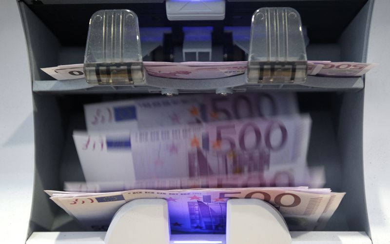 Money counter counts 500 euro banknotes in a Bank in Bern