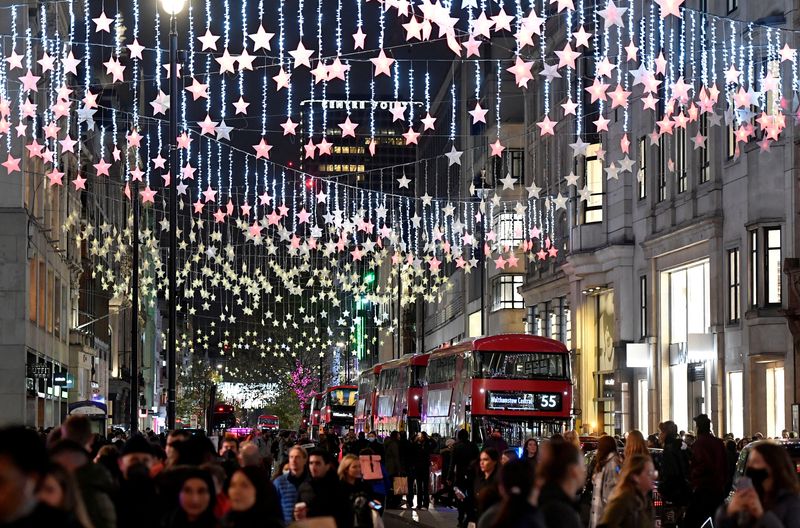 FILE PHOTO: Bus passengers view a Christmas light display along Oxford Street, London