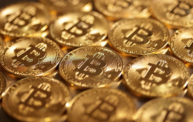 FILE PHOTO: FILE PHOTO: Illustration shows representations of cryptocurrency Bitcoin