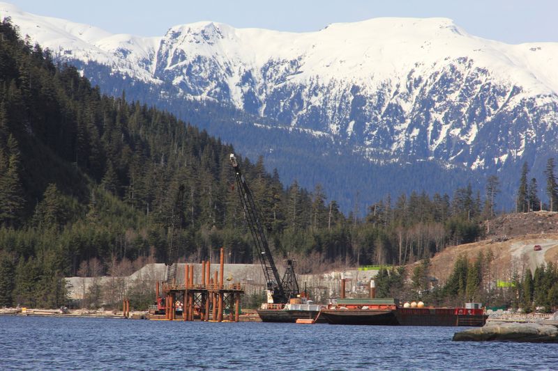 FILE PHOTO: Cranes in the water at the Kitimat LNG site near Kitimat, in northwestern British Columbia