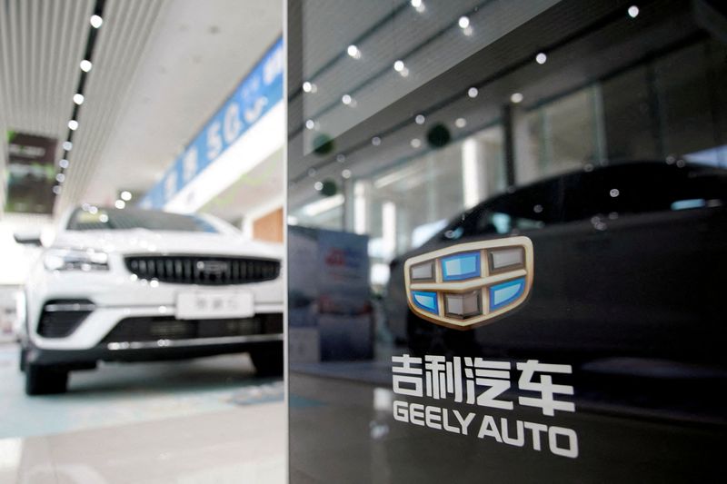 FILE PHOTO: The Geely logo is seen at a car dealership in Shanghai