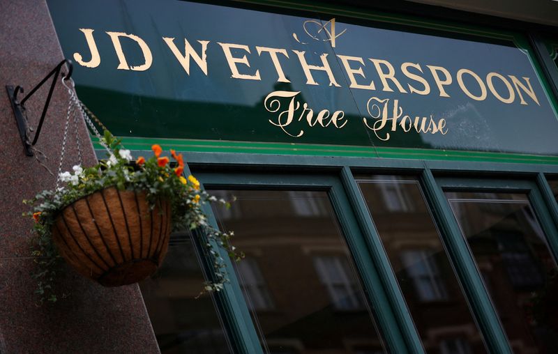 FILE PHOTO: A Wetherspoon's sign on one of its pubs in central London
