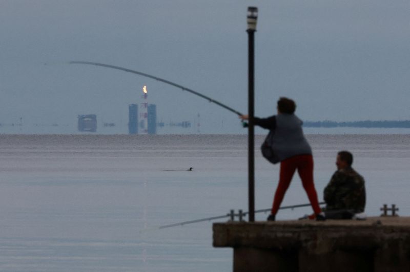 FILE PHOTO: A view shows a gas flare at Portovaya Bay in the Gulf of Finland