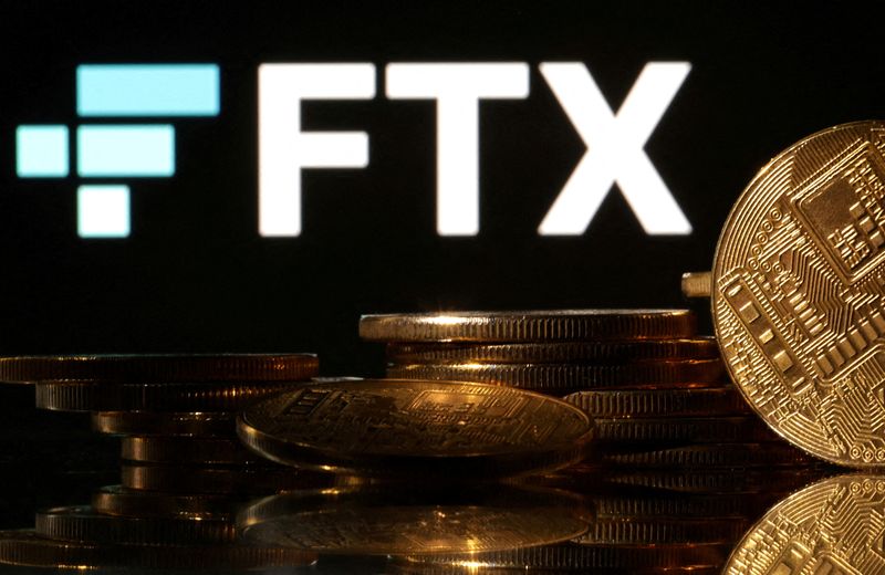 FILE PHOTO: Illustration shows FTX logo and representation of cryptocurrencies