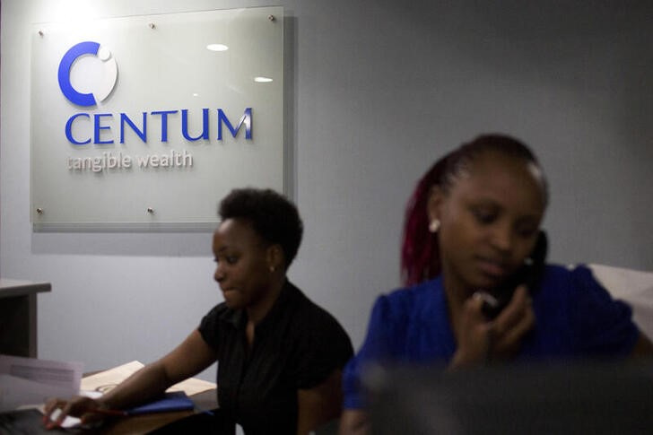 FILE PHOTO: Women work at the front desk of the Centum Investment Company Limited in Nairobi, Kenya