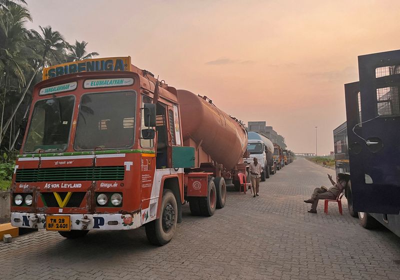 FILE PHOTO: Supply trucks carrying construction materials for the proposed Vizhinjam Port are parked near the port