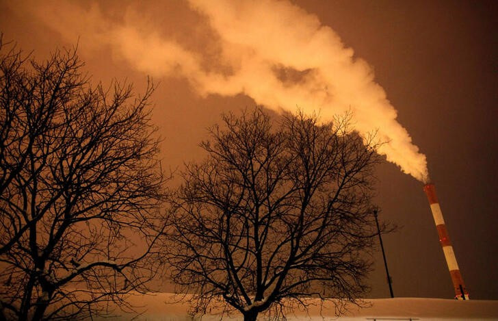 FILE PHOTO: Steam and other emissions rise from a power station in Belgrade