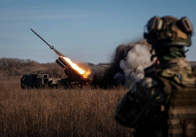 Ukrainian servicemen fire with a Bureviy multiple launch rocket system at a position in Donetsk region