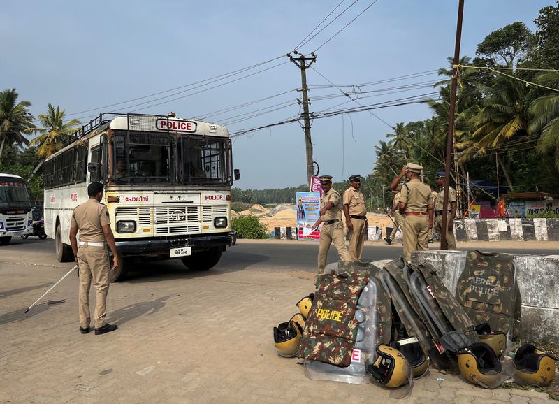 Members of police arrive at a protest site ahead of a rally by the supporters of the proposed Vizhinjam port project