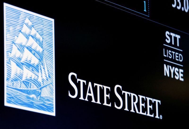 FILE PHOTO: The ticker and logo for State Street Corporation is displayed on a screen at the post where it's traded on the floor of the NYSE