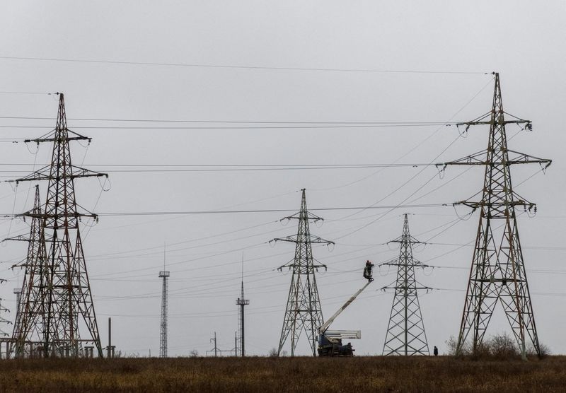 FILE PHOTO: Electric power lines damaged by Russian military strikes in Kherson region