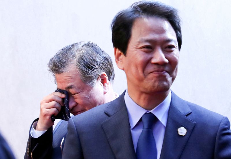 FILE PHOTO: Suh-hoon, South Korea's chief of the National Intelligence Service (NIS) cries after delivering a joint statement, next to Im Jong-seok, South Korea's chief presidential secretary, at the truce village of Panmunjom