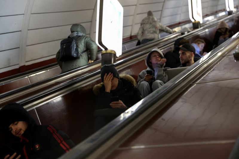 People take shelter inside the metro station amid Russian missile attacks in Kyiv, Ukraine