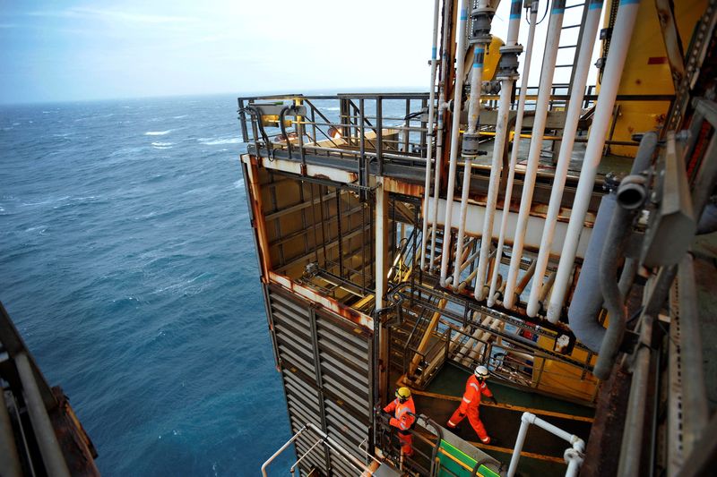 FILE PHOTO: Employees work on the BP Eastern Trough Area Project (ETAP) oil platform in the North Sea, around 100 miles east of Aberdeen
