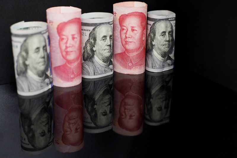 FILE PHOTO: Illustration picture of Chinese yuan and U.S. dollar banknotes