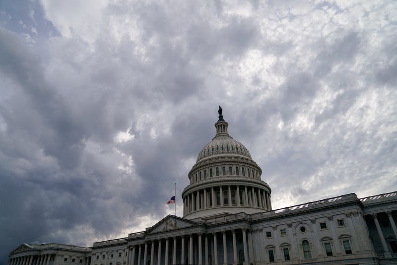 FILE PHOTO: Clouds form over the U.S. Capitol in Washington