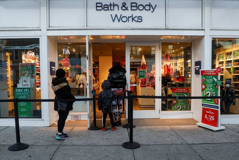 Shoppers wait in line outside a Bath and Body Works retail store, as the global outbreak of the coronavirus disease (COVID-19) continues,  in Brooklyn, New York