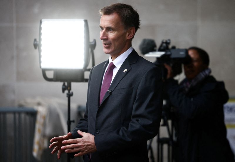 FILE PHOTO: British Chancellor of the Exchequer Jeremy Hunt talks to a television crew outside the BBC headquarters in London