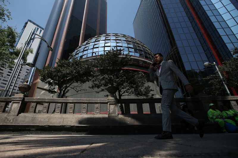 A man walks outside the building of Mexico's stock exchange in Mexico City