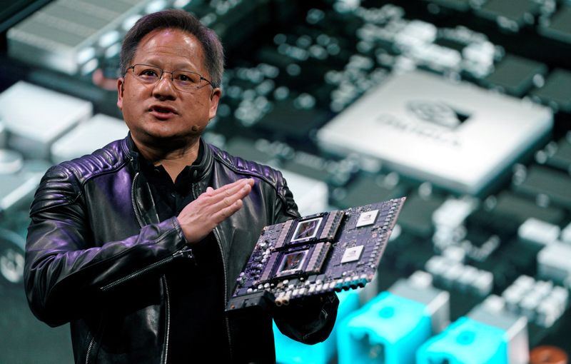 FILE PHOTO: Jensen Huang, CEO of Nvidia, shows the Drive Pegasus robotaxi AI computer at his keynote address at CES in Las Vegas