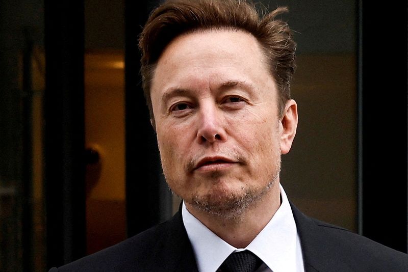 FILE PHOTO: FILE PHOTO: Tesla CEO Musk departs the company’s local office in Washington