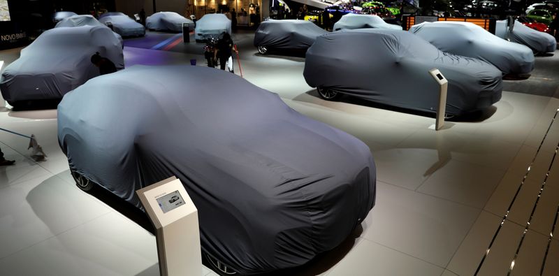FILE PHOTO: Covered new cars are displayed during the Salao do Automovel International Auto Show in Sao Paulo
