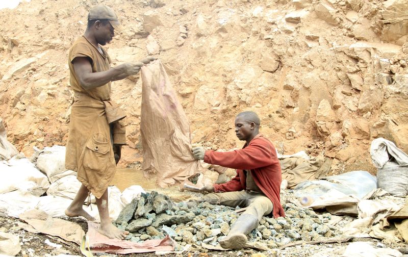 FILE PHOTO: Artisanal miners work at a cobalt mine-pit in Tulwizembe, Katanga province, Democratic Republic of Congo