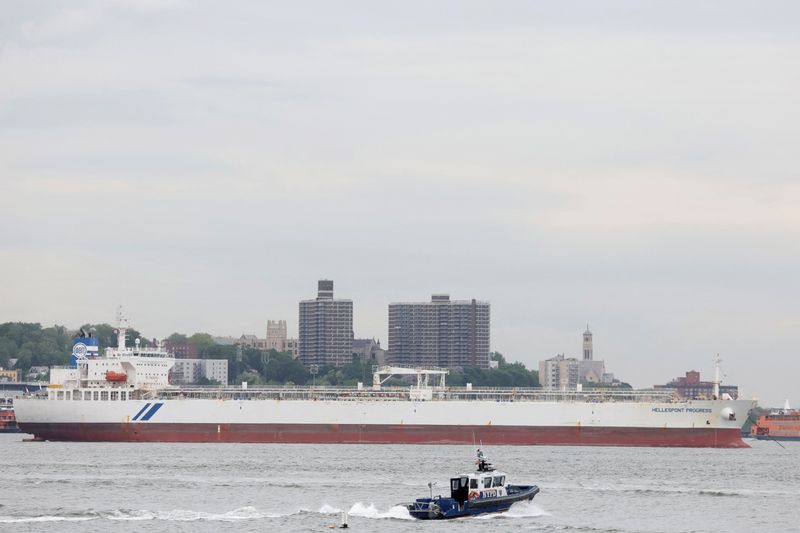 FILE PHOTO: A NYPD boat passes by the Hellespont Progress, an oil tanker anchored in New York Harbor