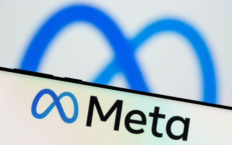 FILE PHOTO: Meta Platforms Inc's logo is seen on a smartphone in this illustration picture