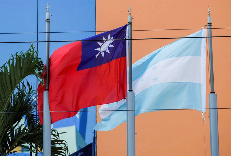 FILE PHOTO: The flags of Taiwan and Honduras flutter in the wind outside the Taiwan Embassy in Tegucigalpa