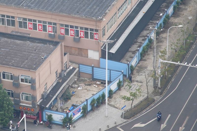 FILE PHOTO: The building of Huanan seafood market, where the second floor remains open for optics stores, and where coronavirus believed to have first surfaced, almost a year after the start of the coronavirus disease (COVID-19) outbreak, in Wuhan
